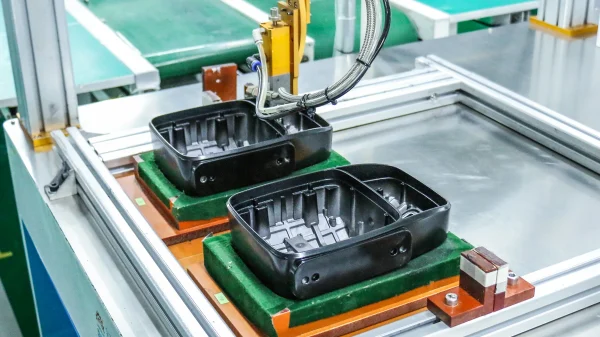 Automatic gluing process at Totron factory